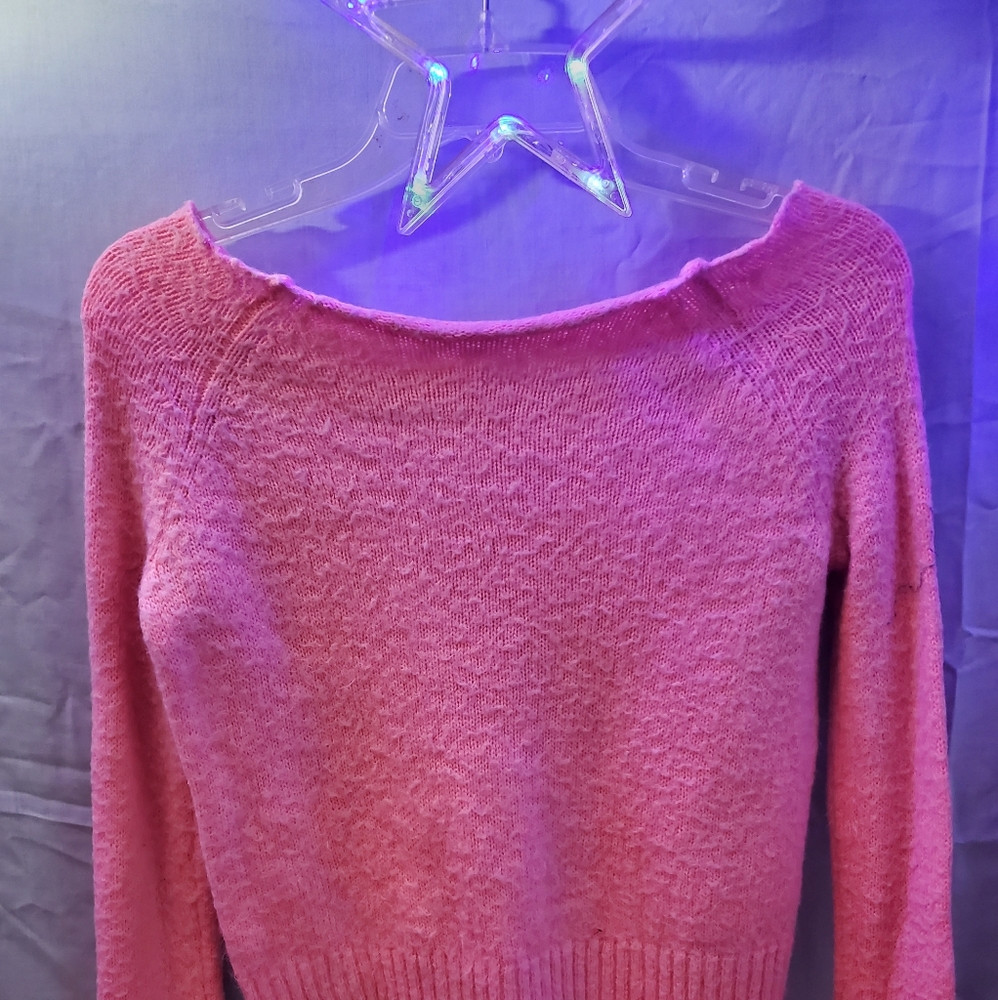 Pink sweater.